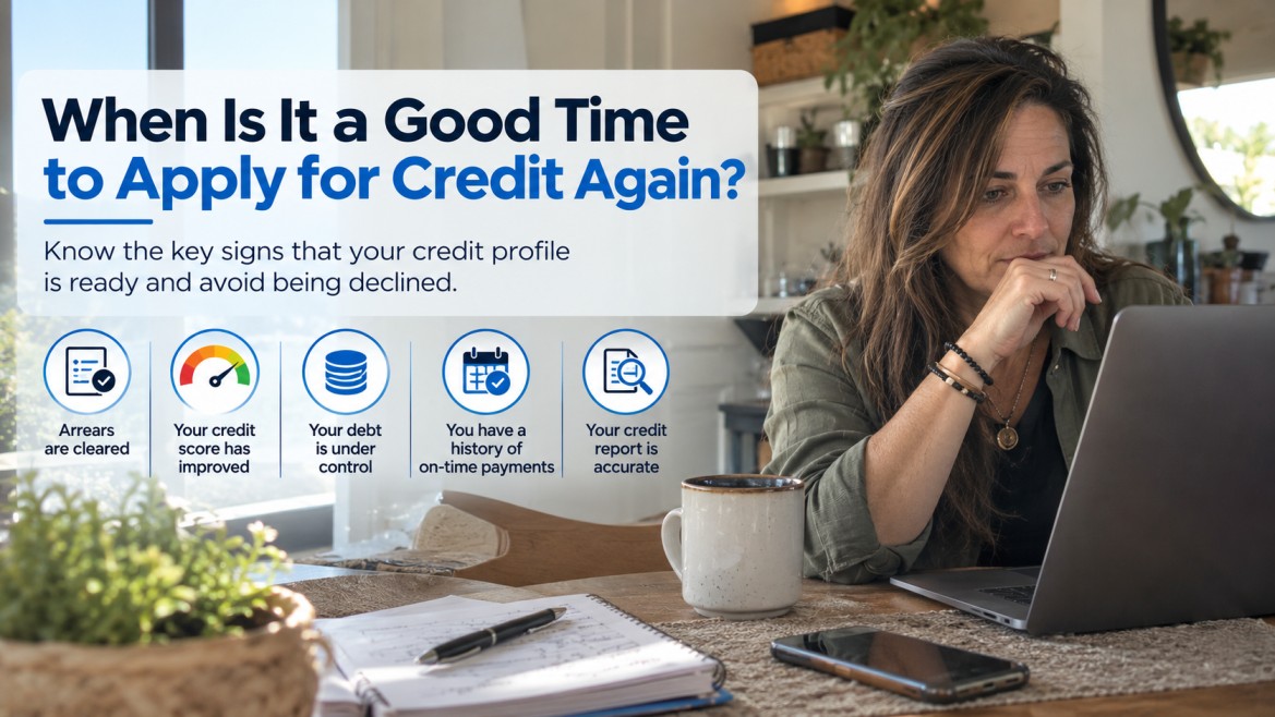 When Is It a Good Time to Apply for Credit Again? Woman reviewing her credit profile on a laptop, with five signs that indicate when it may be a good time to apply for credit again.